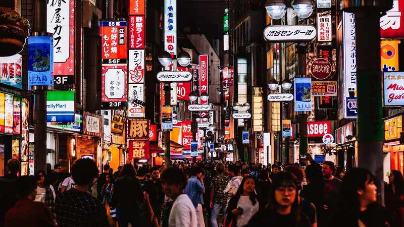 A busy Tokyo street full of neon signs and people. The Japan External Trade Organization (Jetro) said in its annual report this week that exports from the GCC totalled $84 billion in 2024