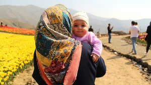 A mother and baby in Karaj, Iran, one of several Gulf states that are falling below the fertility replacement rate