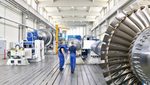 Workers using steam turbines in a factory. Turkey's manufacturing sector improved in February